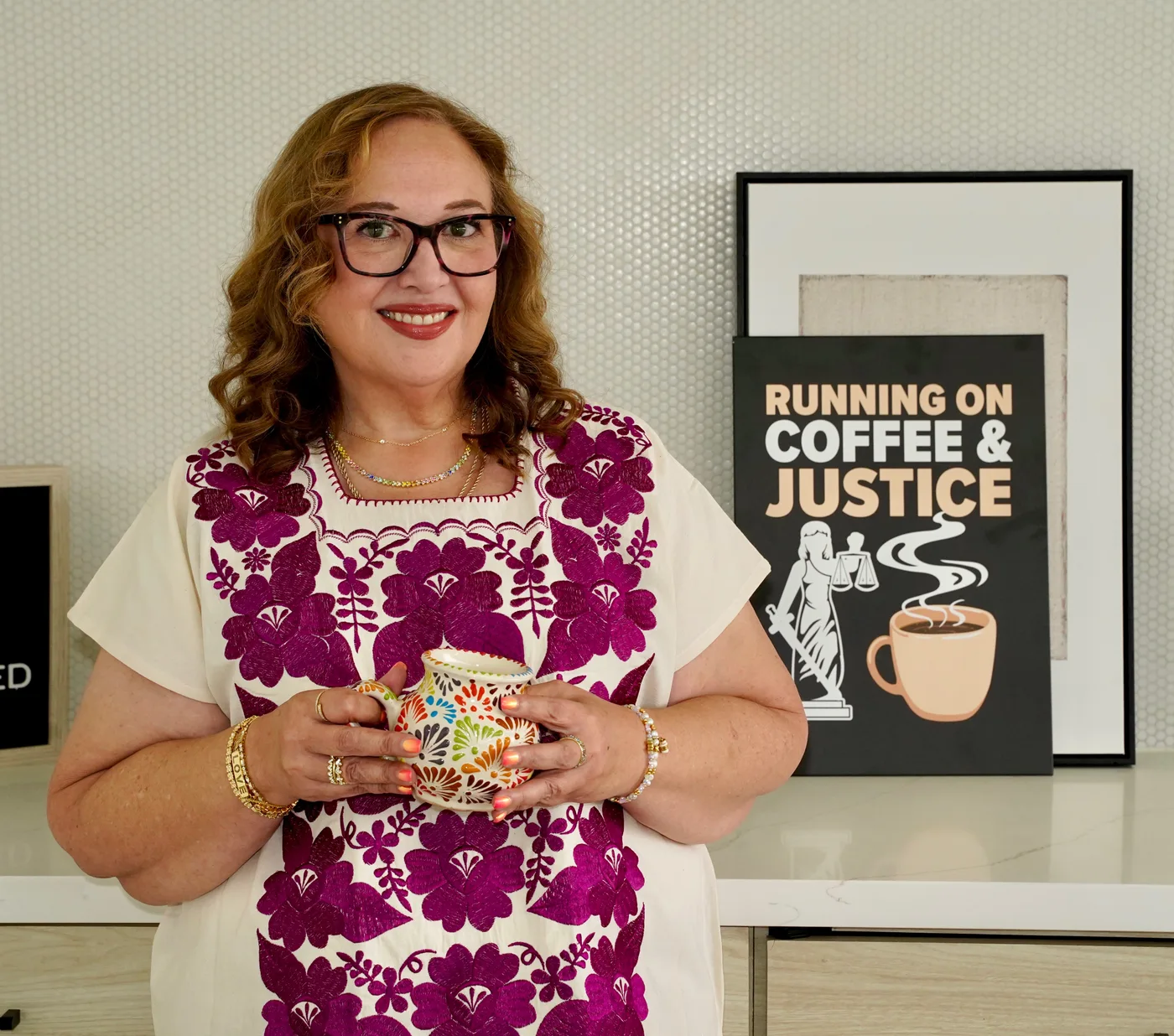Jessica holding a cup of coffee
